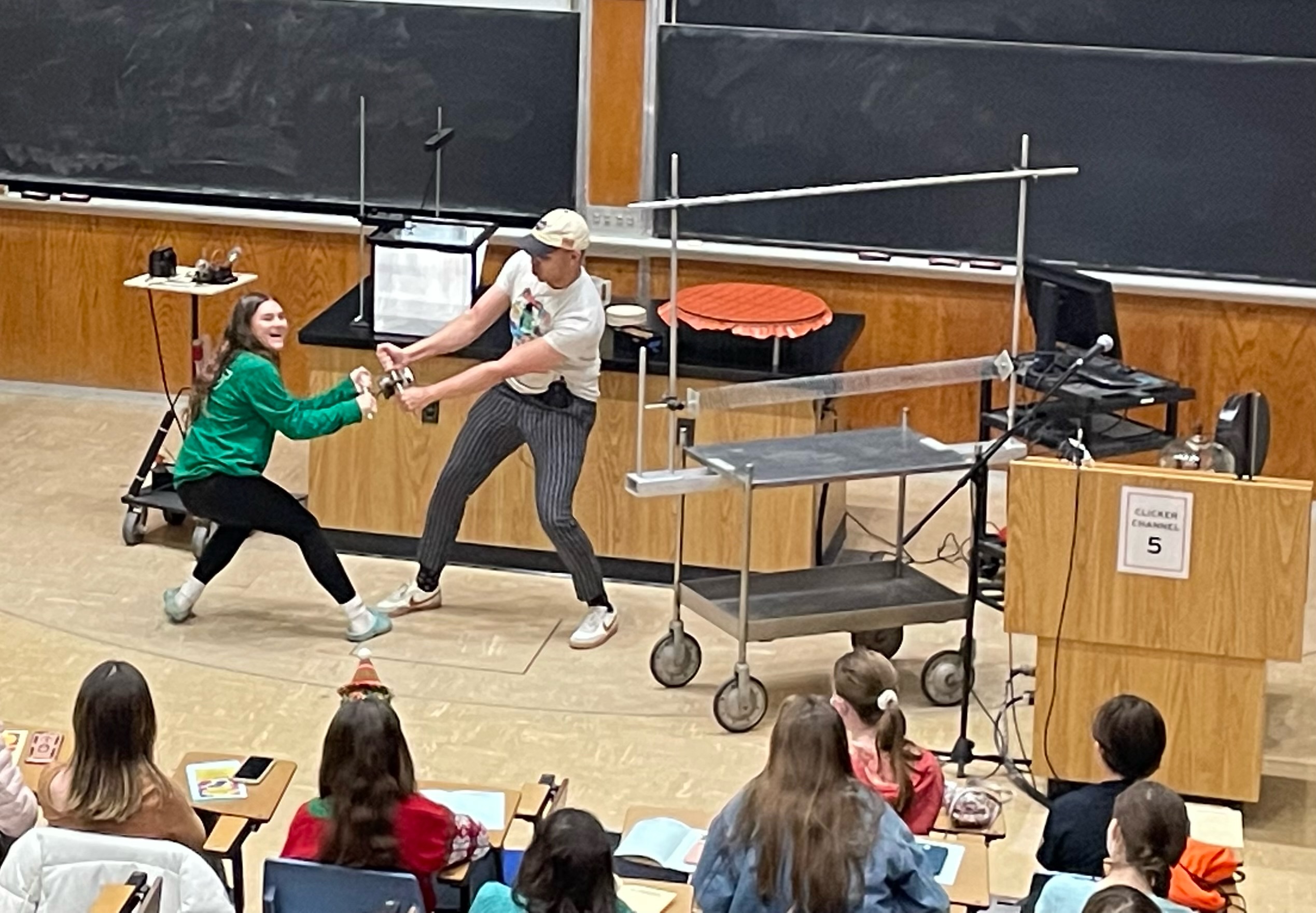 Audience participation! Angel Torres and audience volunteer demonstrating the power of an electromagnet.