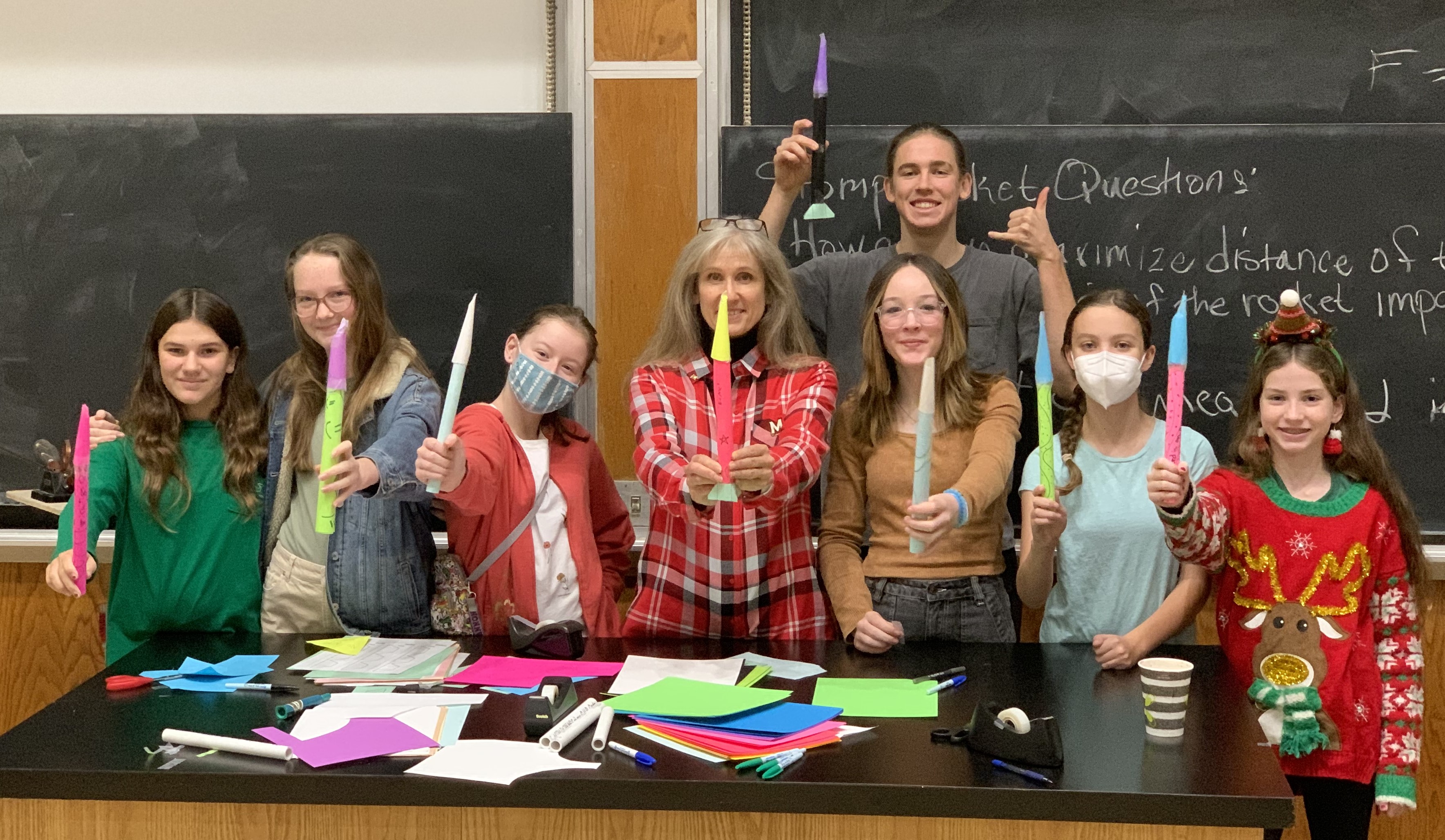 Time to Launch! Undergraduate Bergen Dahl, Donna Hammer, and attendees posing with their rockets.