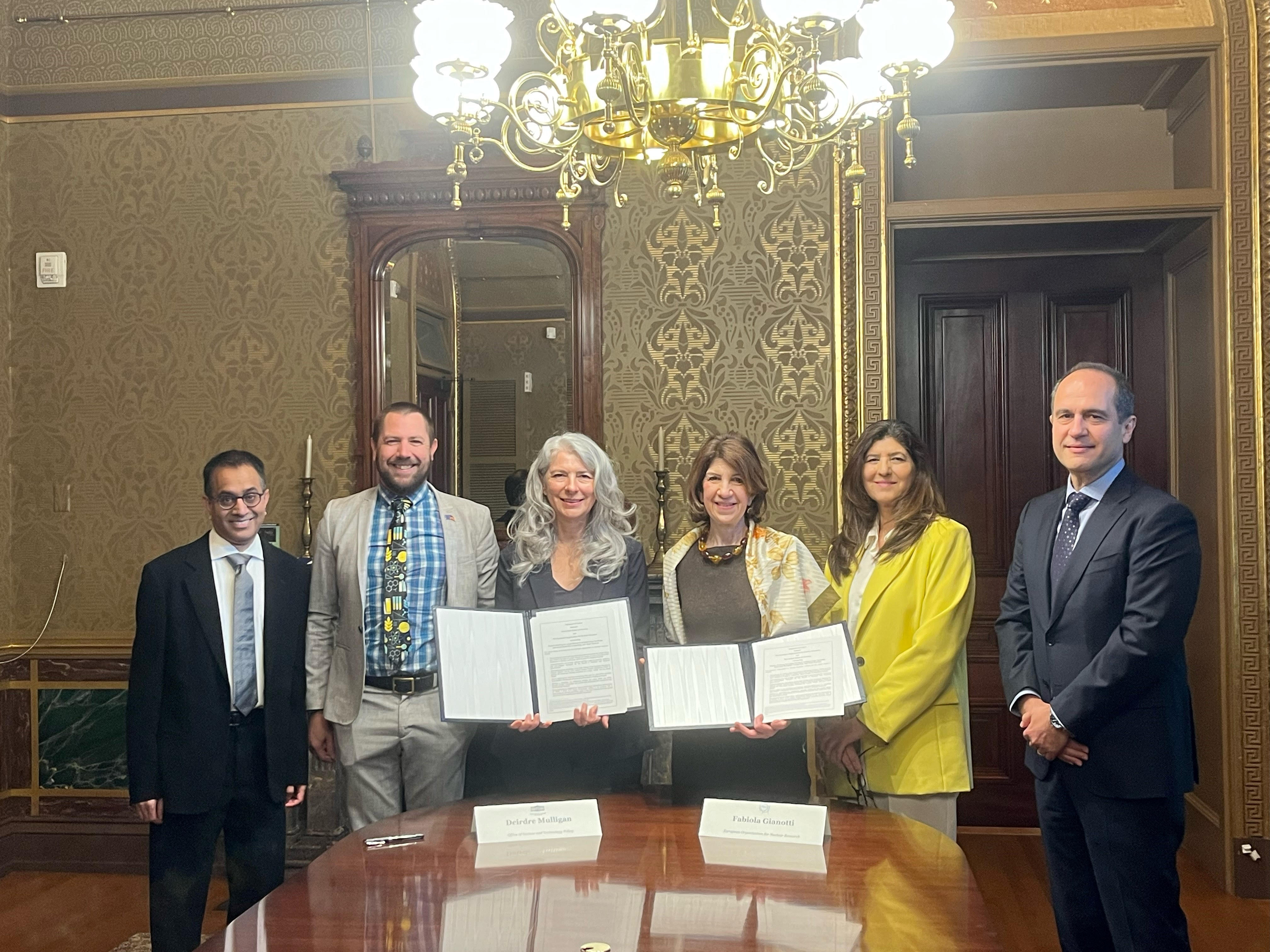 Photo from the signing showing from left-to-right: Abid Patwa (DOE), Chris Marcum (The White House OMB and Open Science Point), Deidre Mulligan (The White House PDCTO), Fabiola Gianotti (CERN DG), Rahima Kandahari (US State Department Deputy Assistant Secretary for Science, Technology, and Space Affairs), and Saul Gonzalez (NSF).