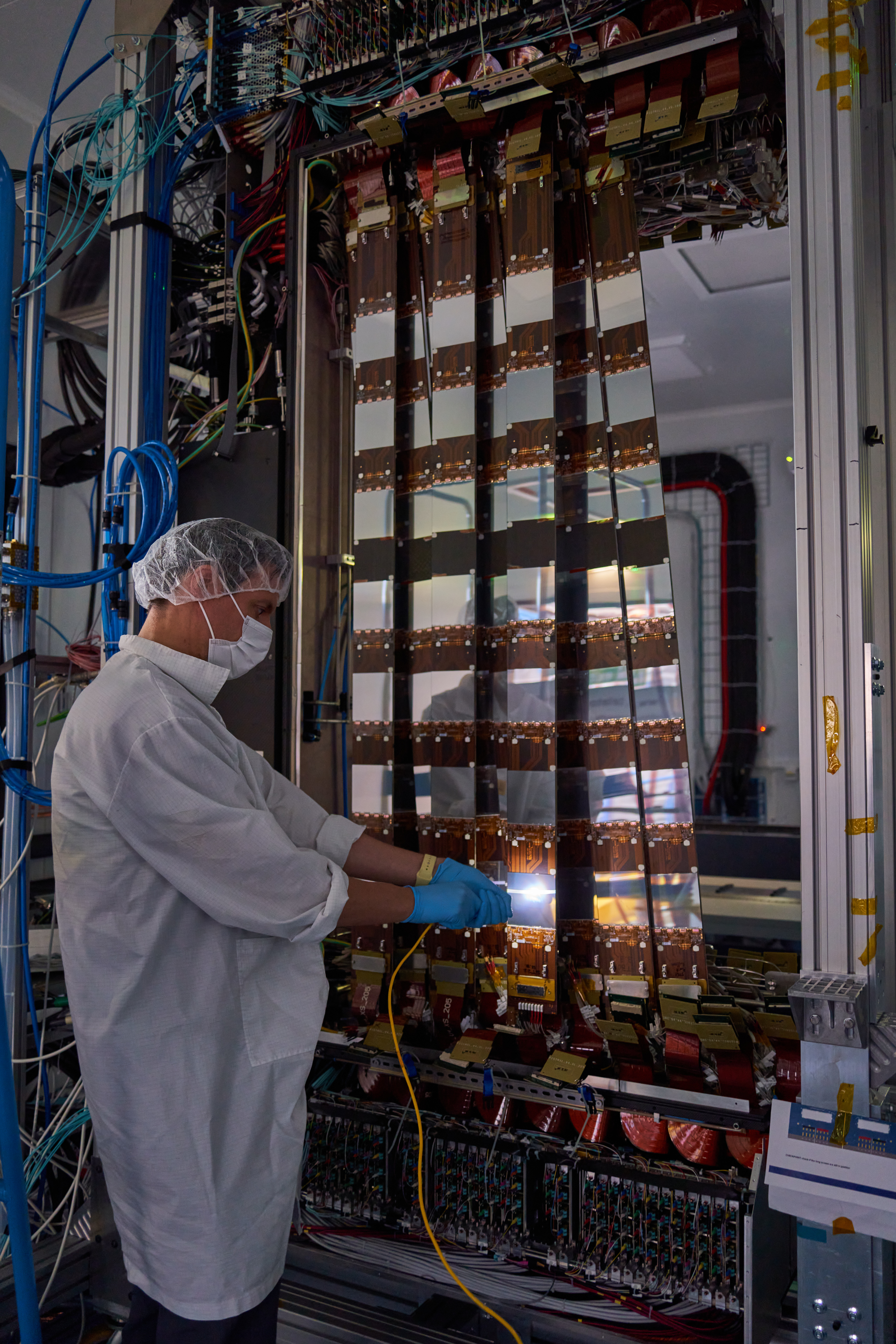 UMD Assistant Professor of Physics Manuel Franco Sevilla is helping to upgrade the Large Hadron Collider (LHC) at CERN in Switzerland. In the above photo, he is shining a light on silicon sensors to measure whether their dark current increases—a sign that they are properly connected. Photo courtesy of Manuel Franco Sevilla.