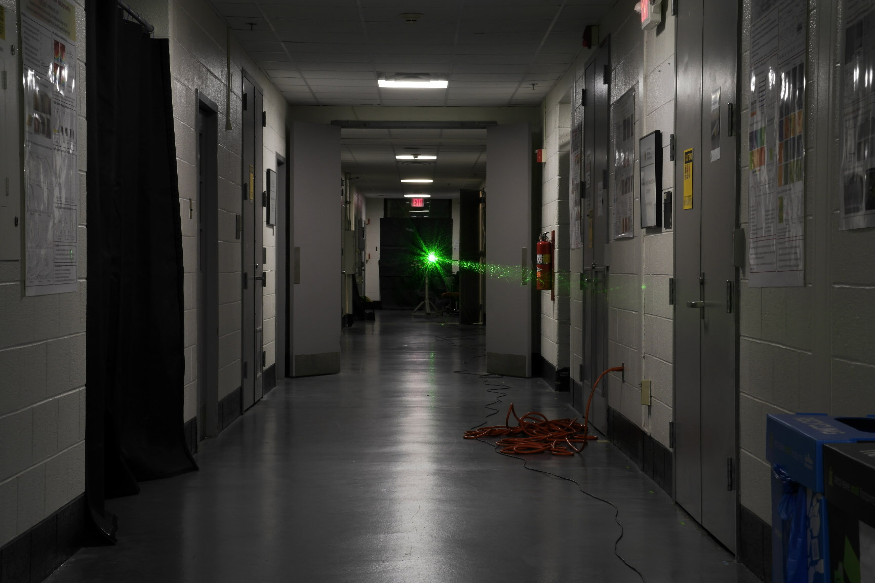 A laser is sent down a UMD hallway in an experiment to corral light as it makes a 45-meters-long journey.
